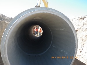 Construction workers and pipe